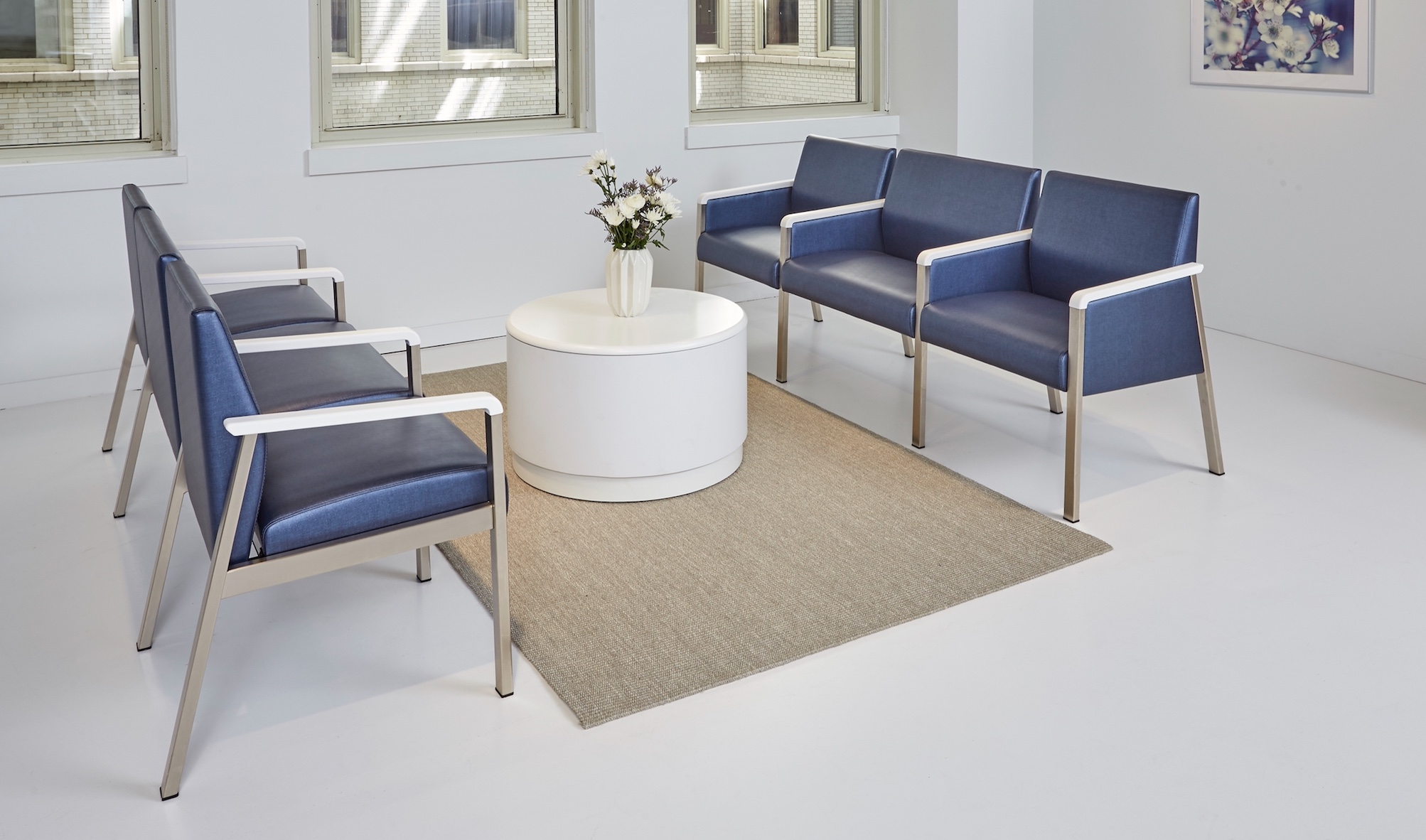 Six Krug Faeron healthcare armchairs in blue vinyl upholstery with metal frame