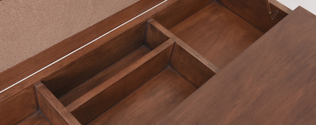 close-up view of interior compartments in solid wood desk