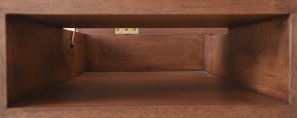 detail view of open compartment in solid mahogany desk