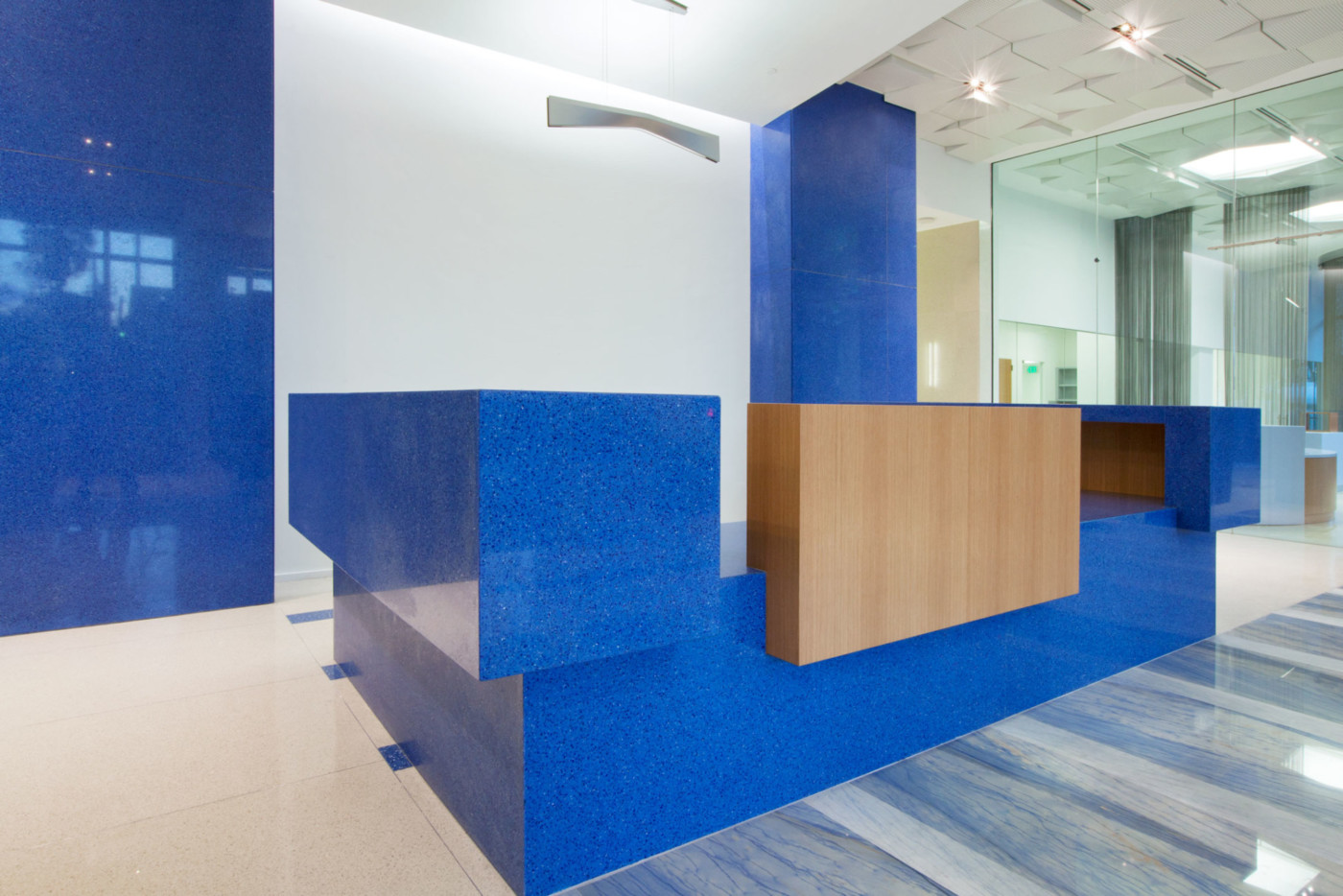 IceStone sapphire snow recycled countertops and wall cladding in office reception area