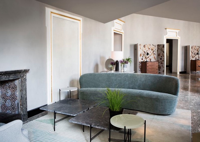 curvy upholstered contemporary sofa inside designer showroom