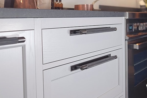 gray cabinets with solid metal Buster + Punch Hardware