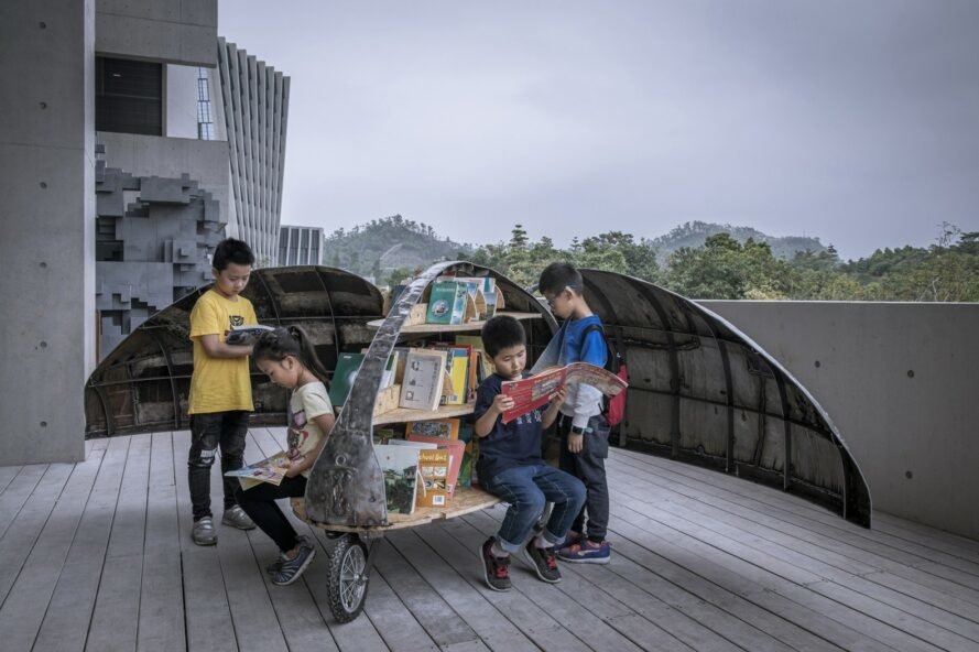 Luo Studio Shared Lady Beetle with four children two sitting on bench/shelf