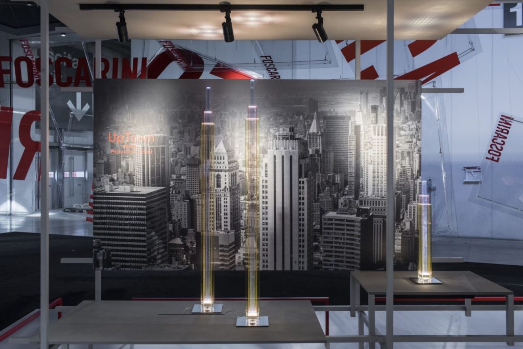 tall floor lamps in front of black and white photo of NYC skyscrapers