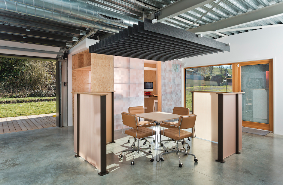 modern office with concrete floors and wood and ecoresin partition with half-walls
