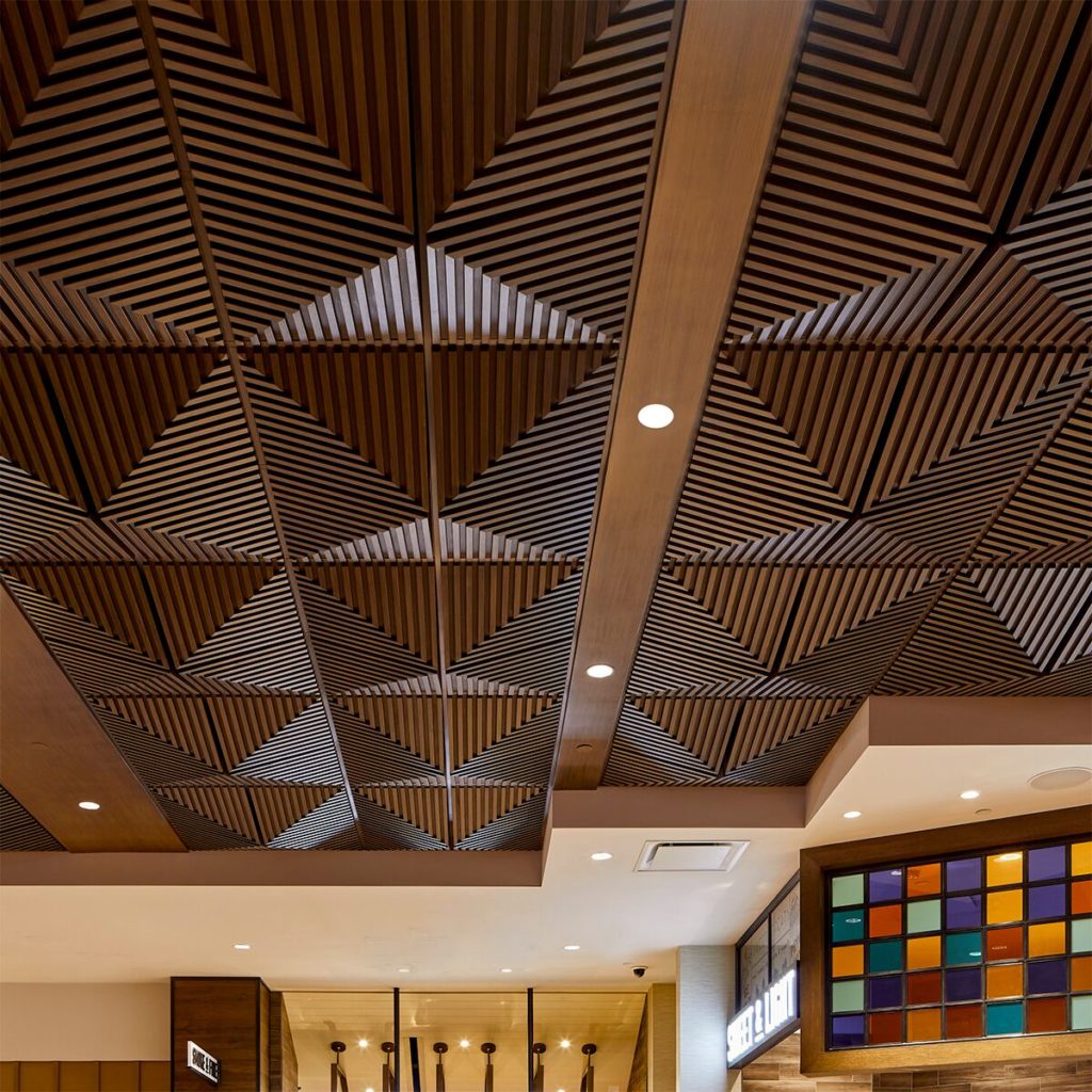 Above View Ceiling Tiles grooved quarter pyramid in dark oak at casino