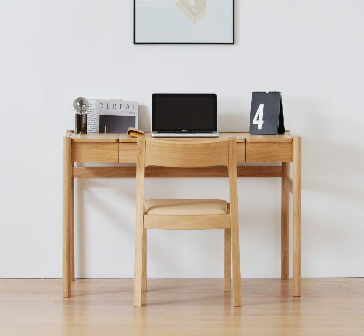 Case Furniture Pala Table front view with chair and work items including laptop on desk