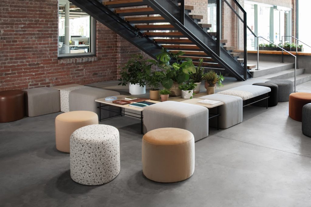 Allsteel Two-Thirds furniture various circular and square poufs and tables in lobby space
