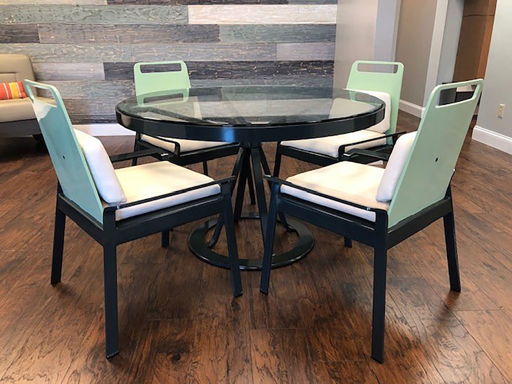 Benchmark Contract Furniture Dune Collection Dining Table and Chairs black table with glass top, chairs with white cushion, mint green backrest, and black frame