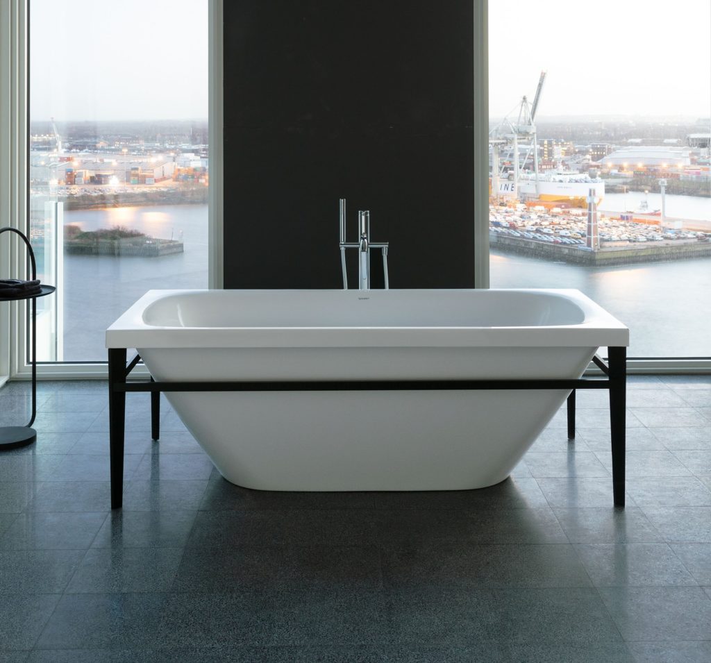Duravit Matte Black products XViu tub in bathroom overlooking sea with cargo ships in the distance