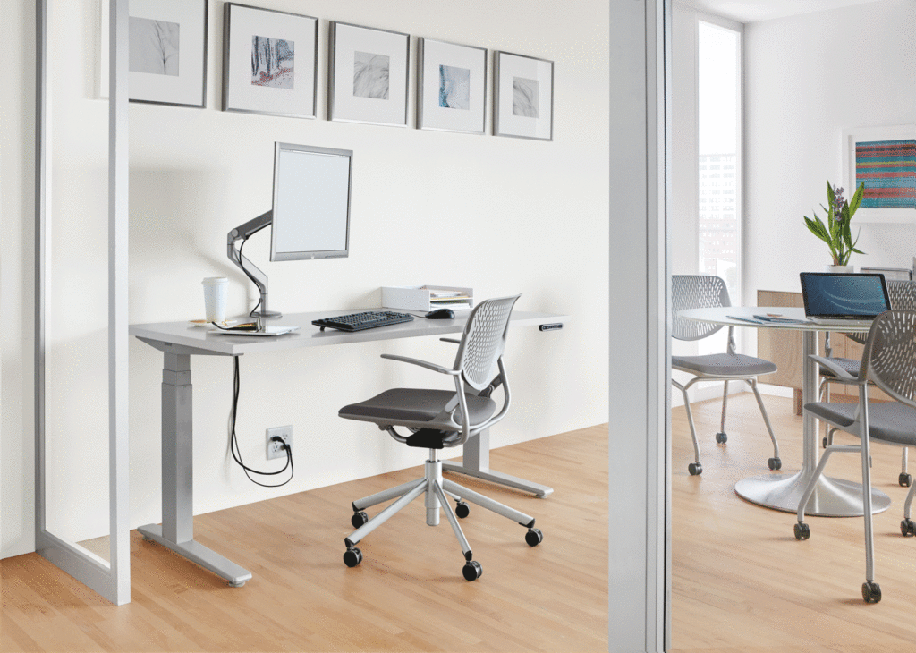 Room & Board Business Interiors SW Electric Desk inoffice with adjacent table and seating 