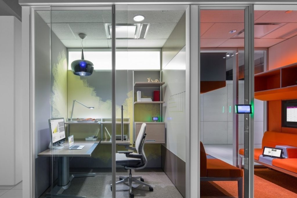 Claudio Bellini Steelcase V.I.A. workroom with glass walls and desk/seating inside 