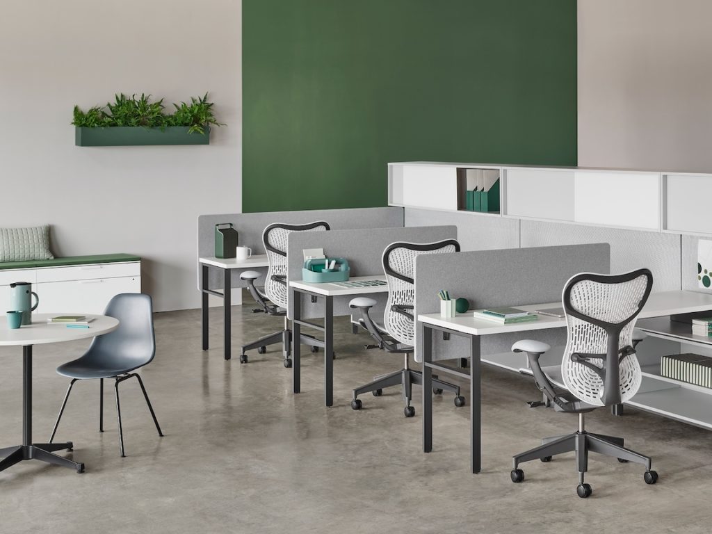 Douglas Ball Canvas Wall system of space dividers shown with other elements of Canvas System in a palette of white/gray with accompanying office chairs