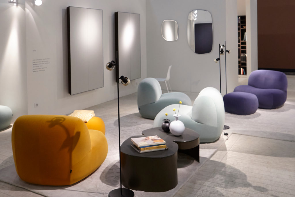 Ligne Roset's Pukka several chairs different colors in showroom