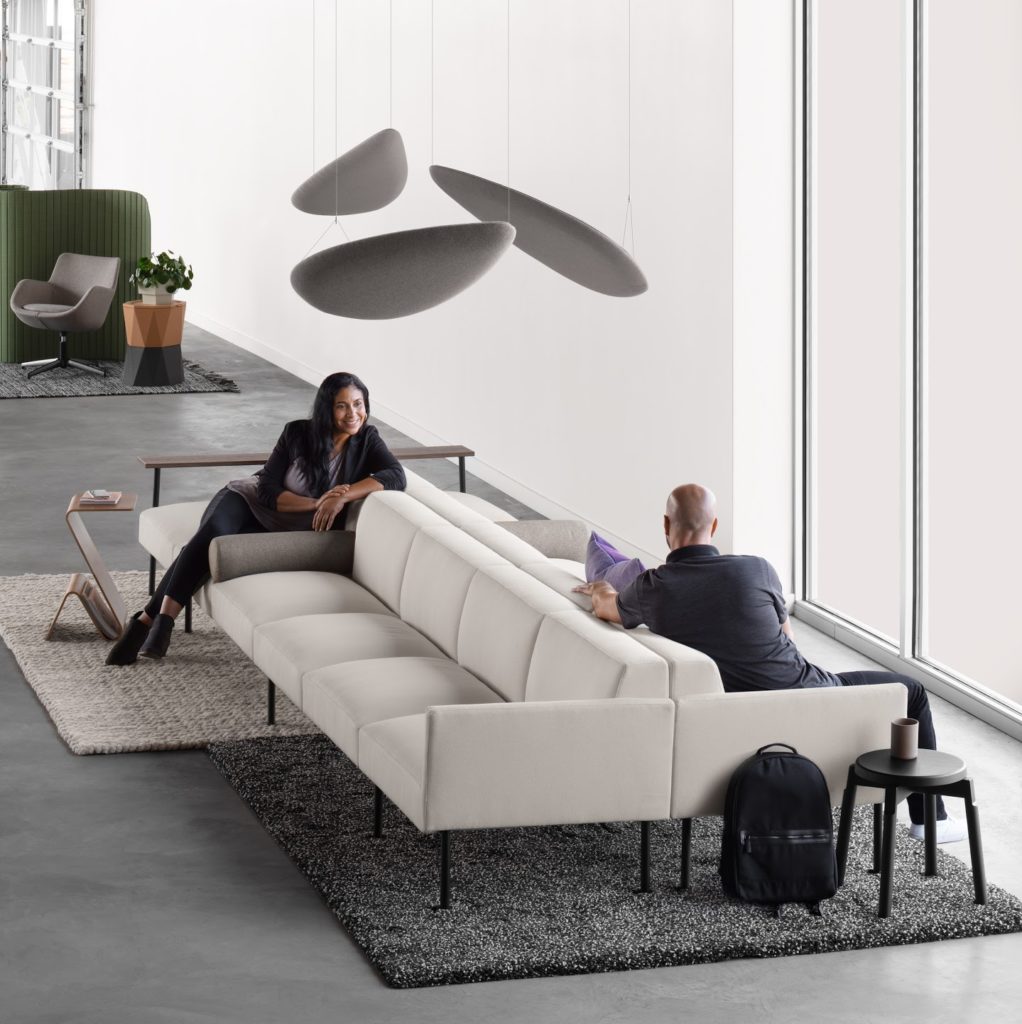Jetty:Mod by Allsteel back to back sofas with socially distanced people