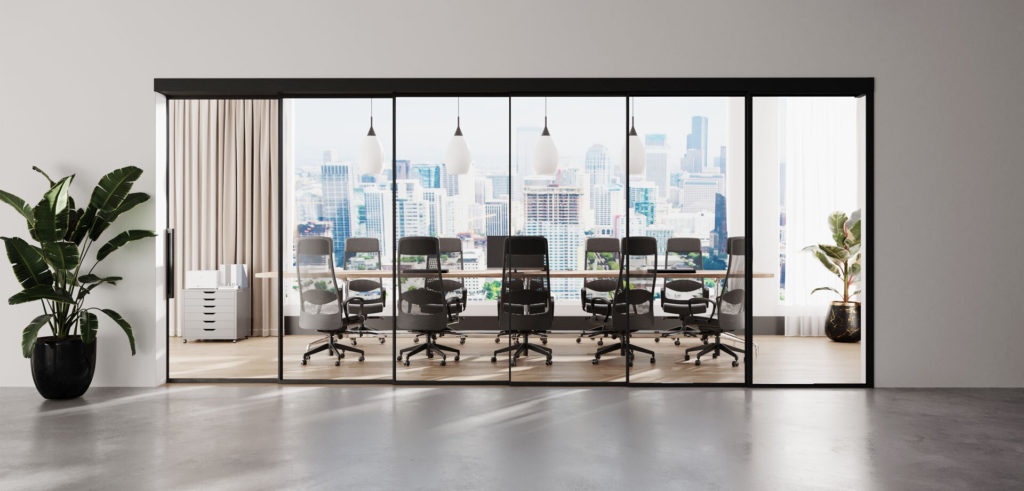Muraflex Expo telescoping door system closed black with conference table and city view