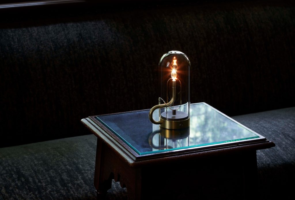Ambientec Hymn lamp on small glass table