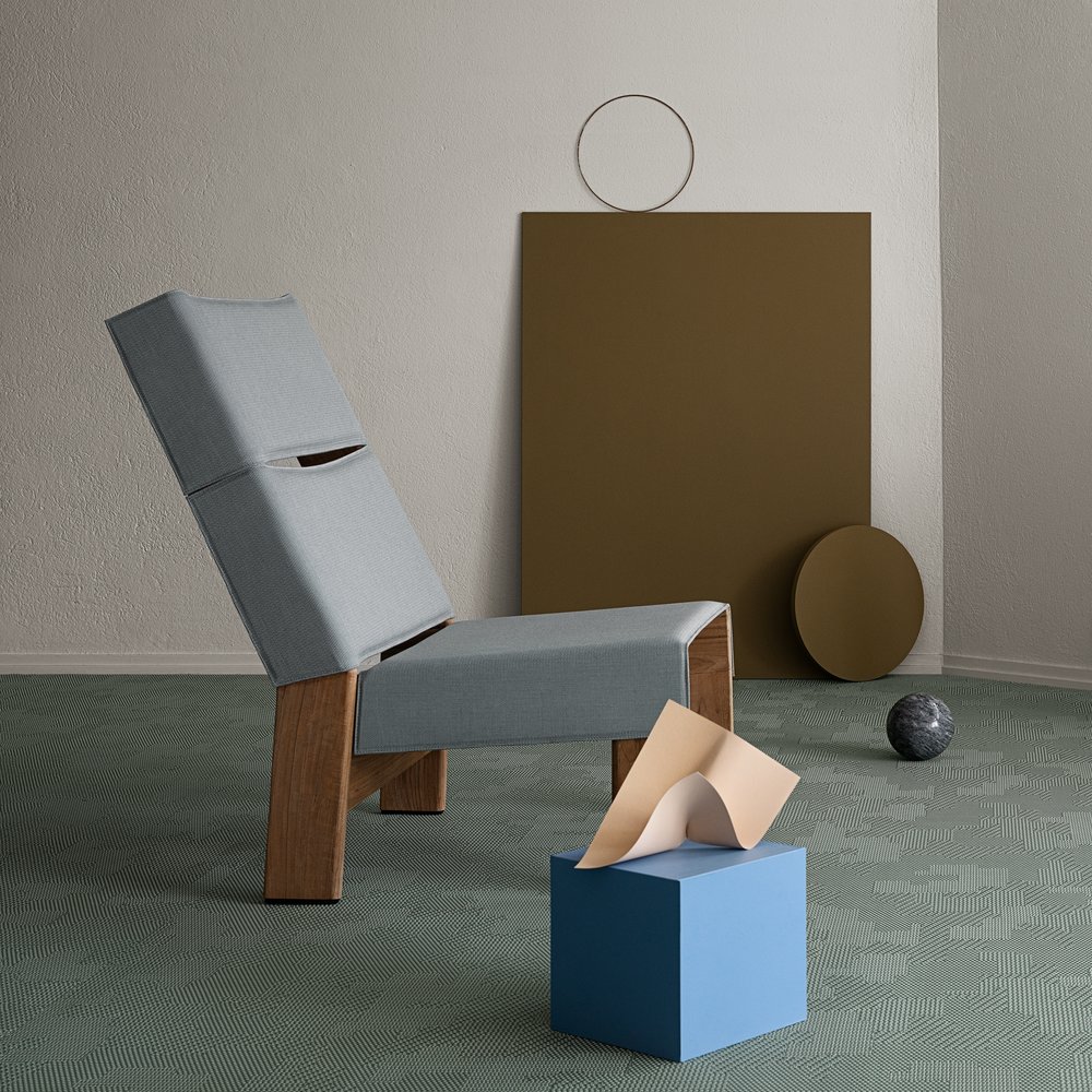 BOLON by Patricia Urquiola Sage in room with gray geometric chair and other geometric art objects