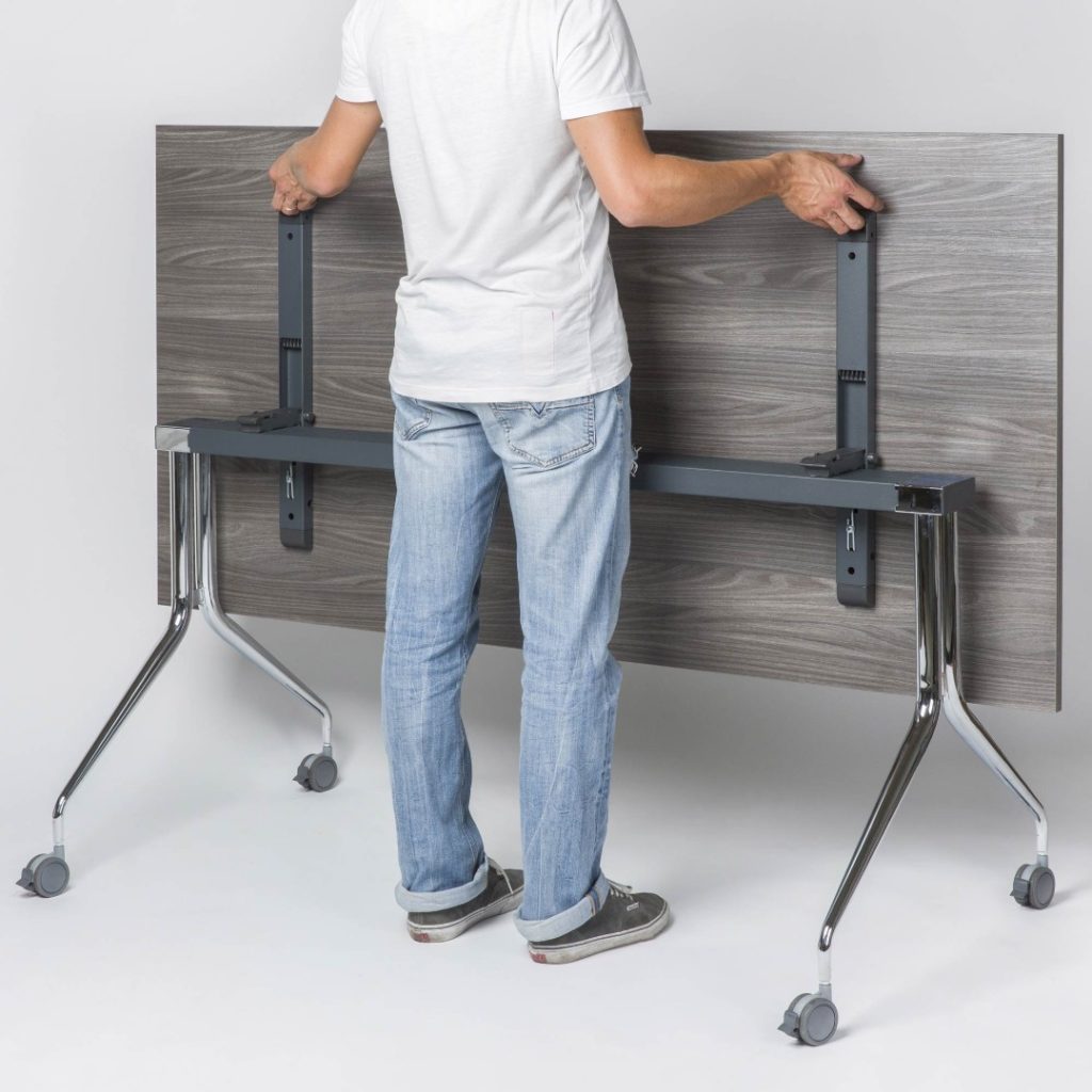 Falcon Tilt Table with man tilting table up into position