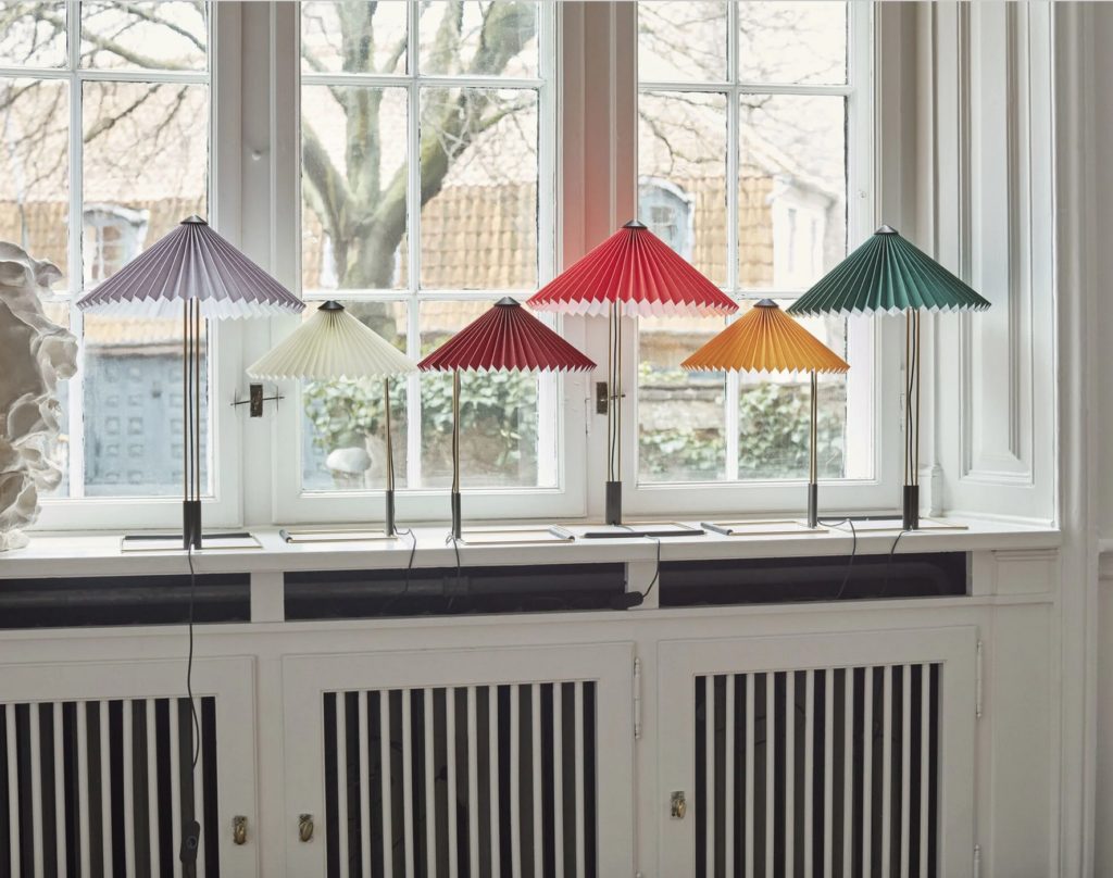Matin six table lamps in window gray, white, purple, red, yellow, green 