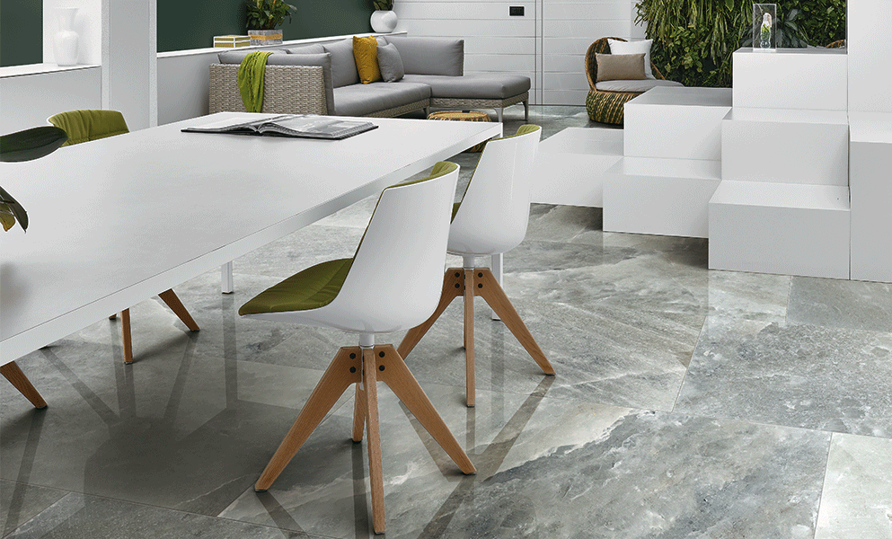 Rock Salt Collection gray/white tile on floor of room with partial image of white table, gray sofa, and solid block installation for seating 