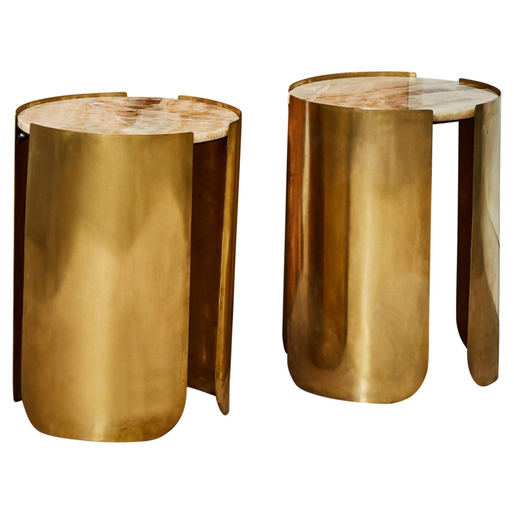 Brass Studio Glustin round pedestal tables 