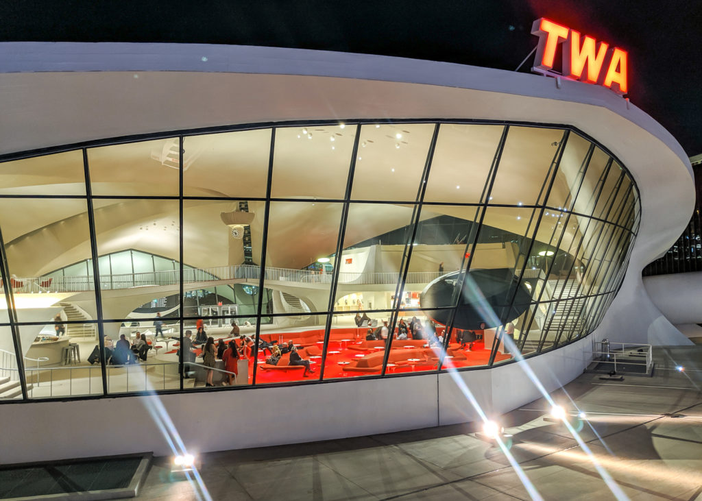 penny tile TWA hotel exterior shot looking inside lobby space