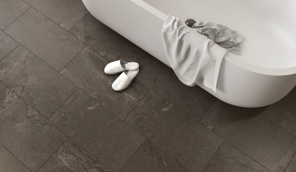 porcelain tile Portugal collection in mid-gray near bathtub with white slippers 