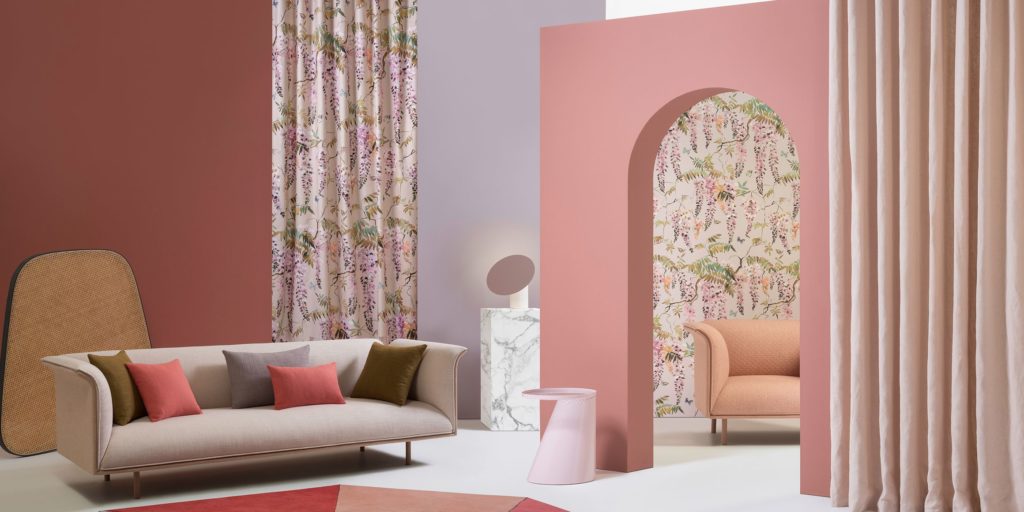 Mokum Papillon textile with leafy floral forms in pink in living room 