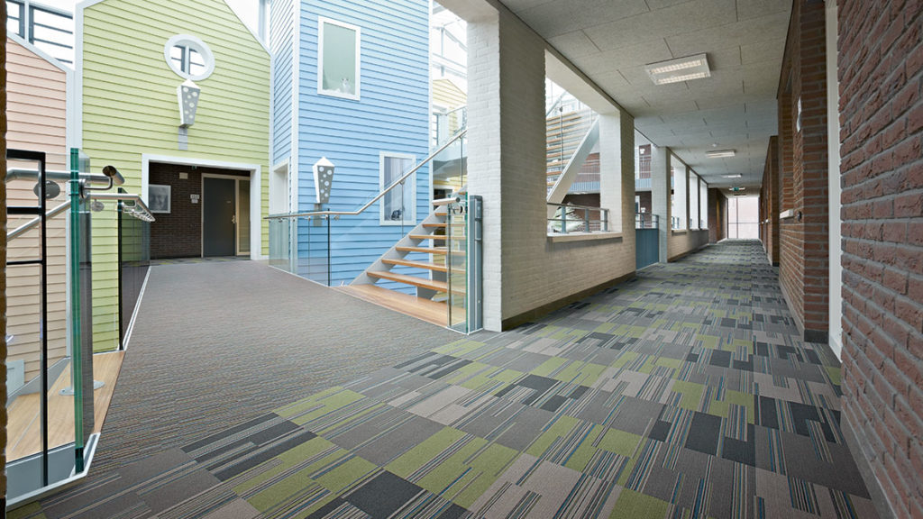 Flotex linear tile in gray, green blue in school hallway