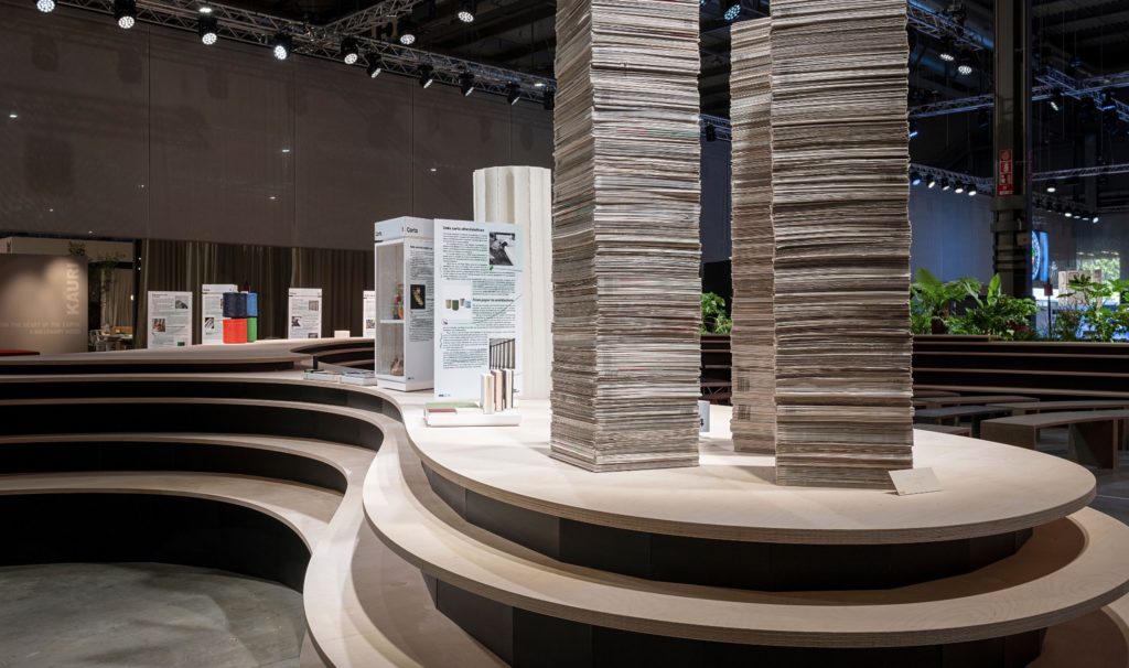 exhibit about paper with huge stacks of newspaper