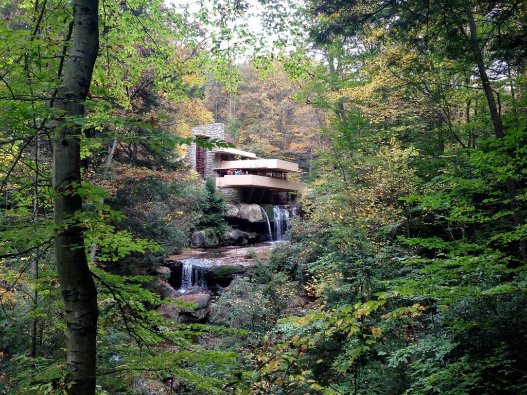 Frank Lloyd Wright Falling Water house as seen through the trees
