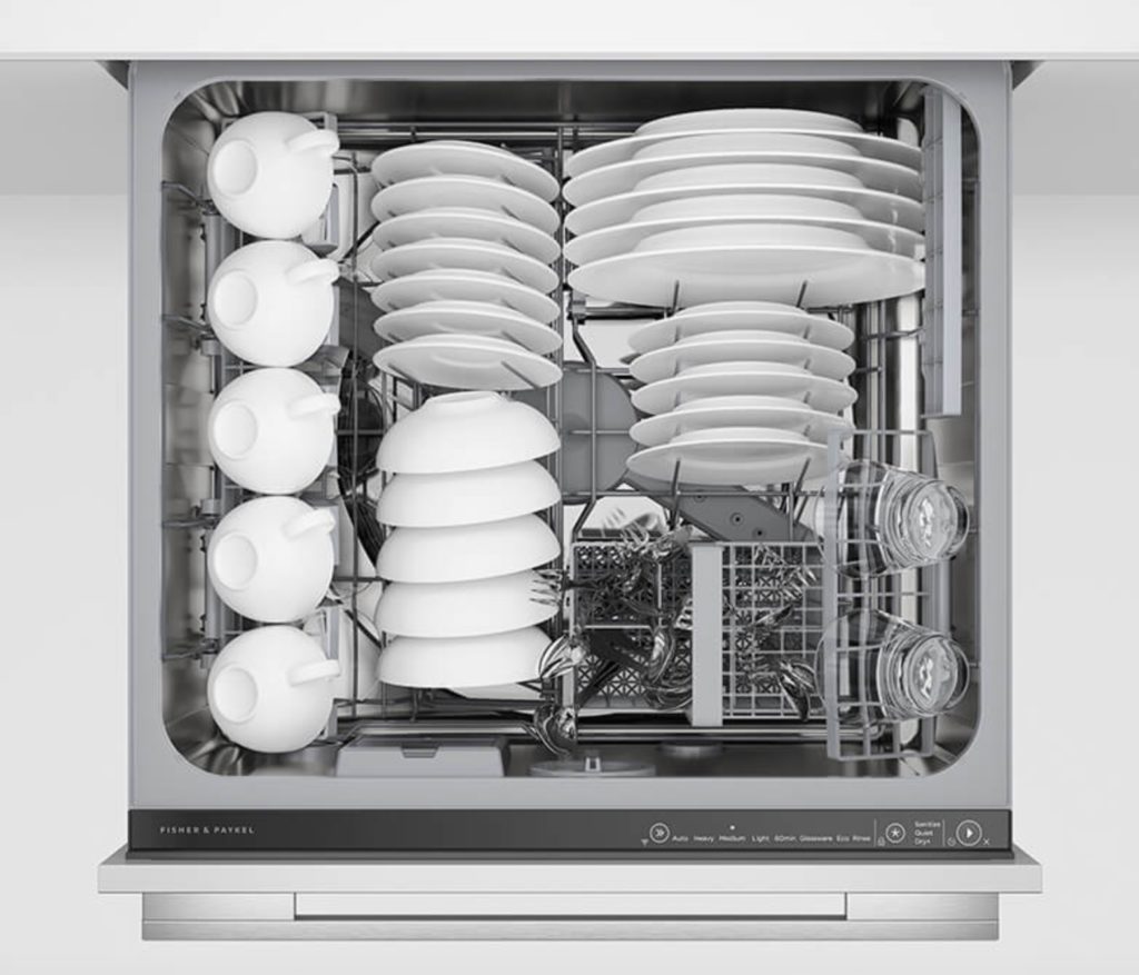 very neatly organized top drawer of dishwasher, full