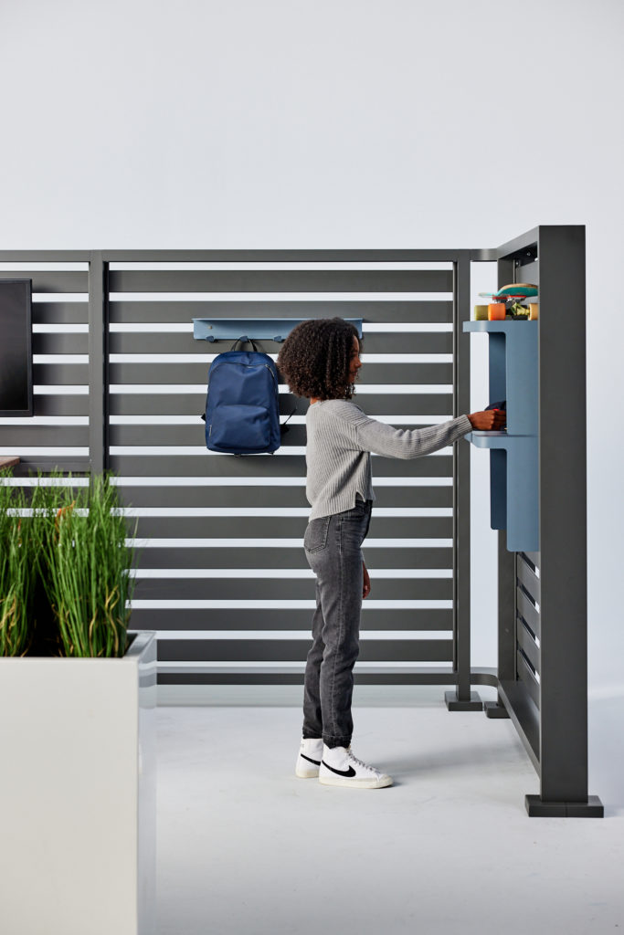 Woman placing items into shelf/cubby