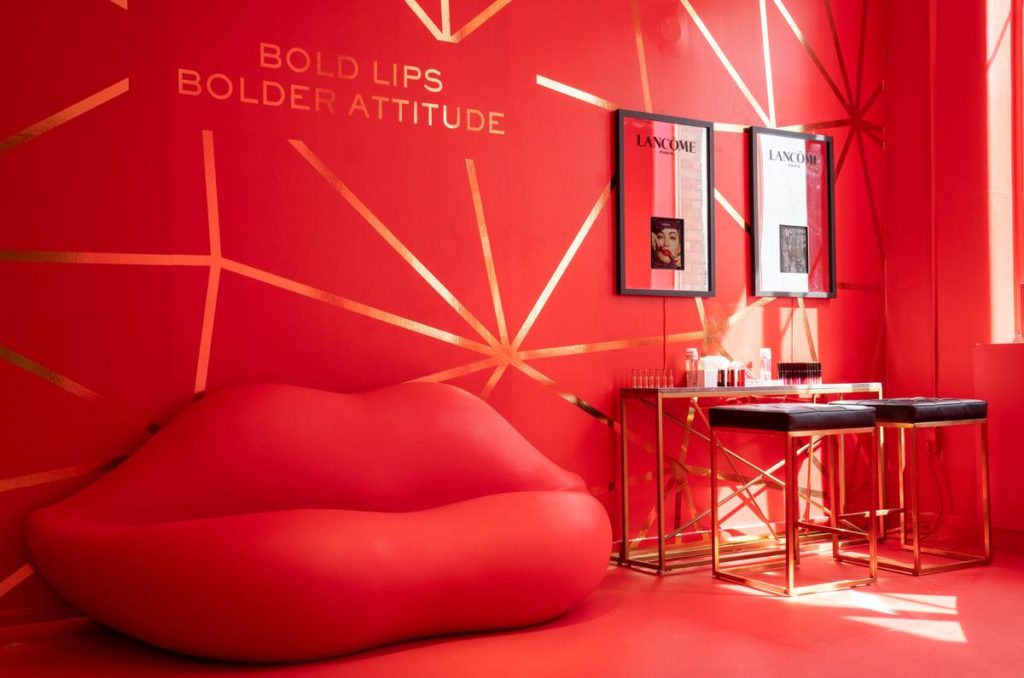 L'oréal custom installation with red walls and gold starbursts