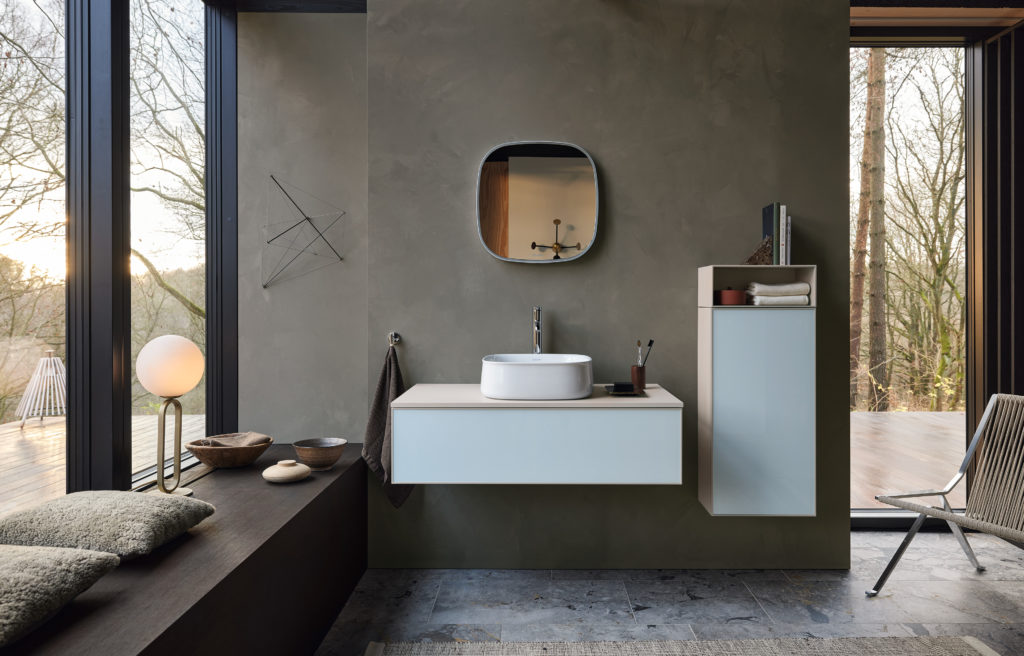 Zencha bathroom line square vanity with open bottom and wood top and above counter sink next to light blue bathroom storage