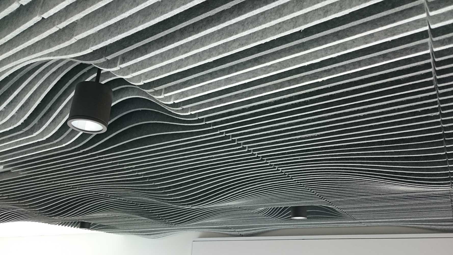 Stille Fella Acoustical Felt wavy pattern on ceiling gray