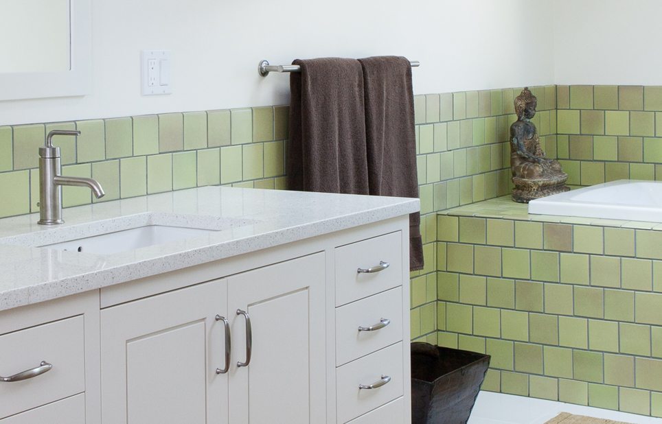 IceStone alpine white recycled countertop in bathroom with green-tile 