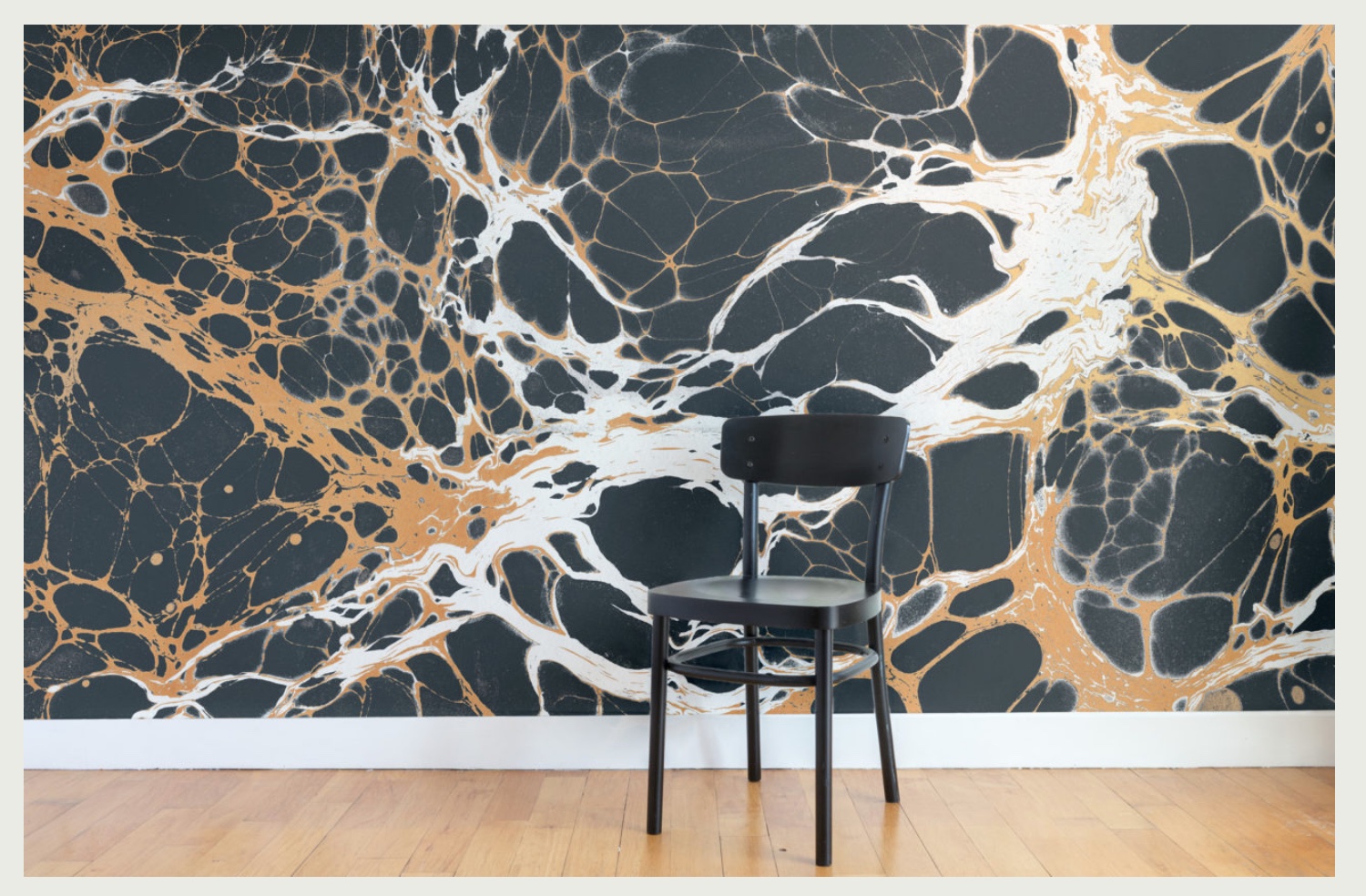Calico Wallpaper Night pattern with black chair in front