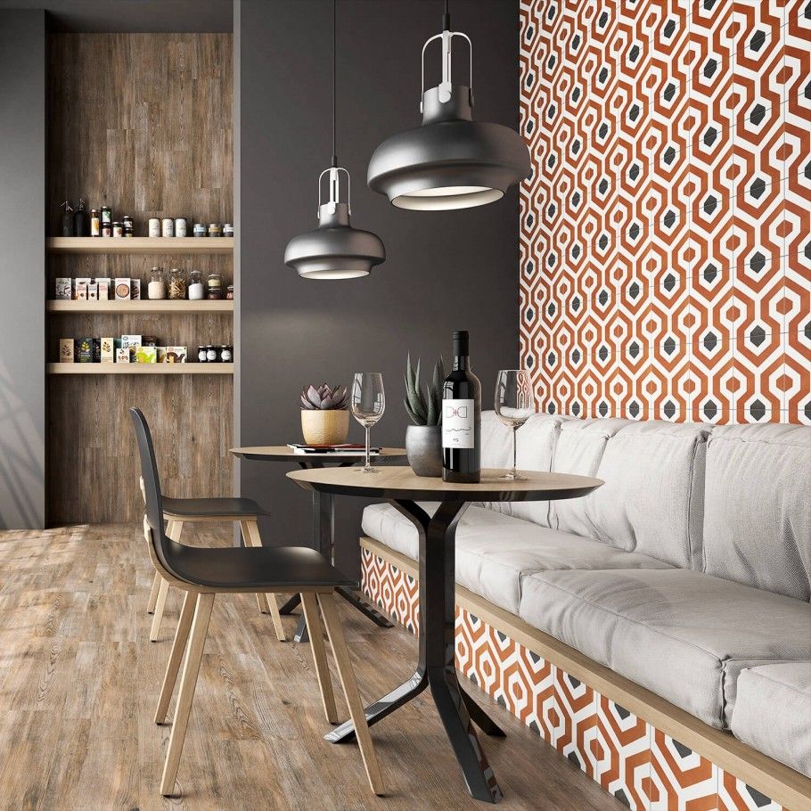 restaurant with tile feature wall in orange and gray geometric design
