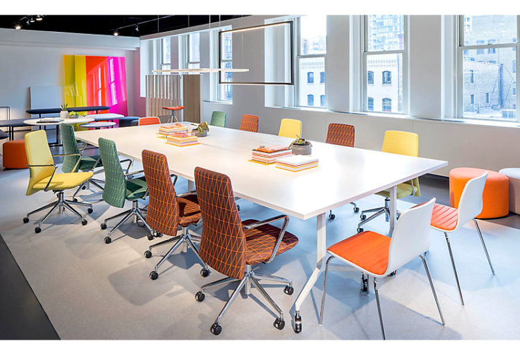 Andaz Seating Guest Chair in orange with other Andaz chairs and table
