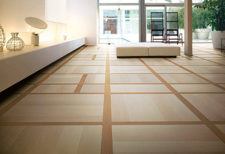 expansive living room with natural wood flooring in grid pattern