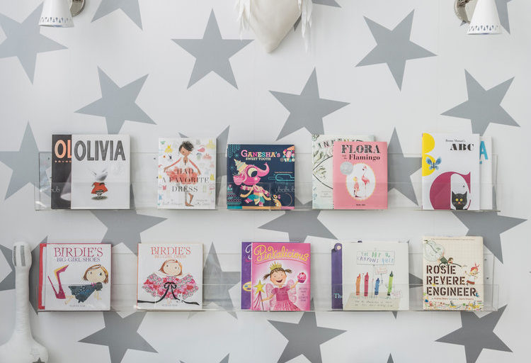 kids room with modern wallpaper with large-scale silver stars
