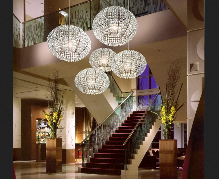 lobby with cluster of five orb-like glass pendants hanging above