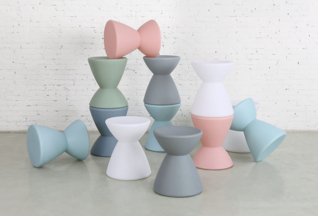 m.a.d. design's Roto Stool several stools in various colors piled atop one another