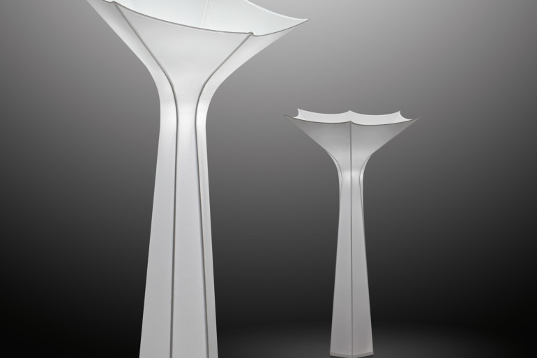 two floor lamps resembling white amorphous flowers