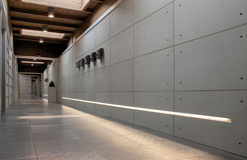 hallway with cement walls with inset linear lighting