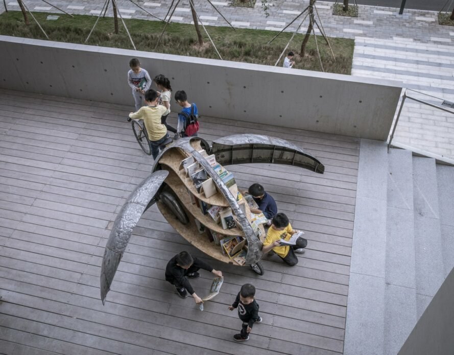 Luo Studio Shared Lady Beetle overhead view with many children exploring it
