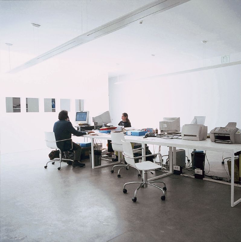 open work space with sleek white metal desks