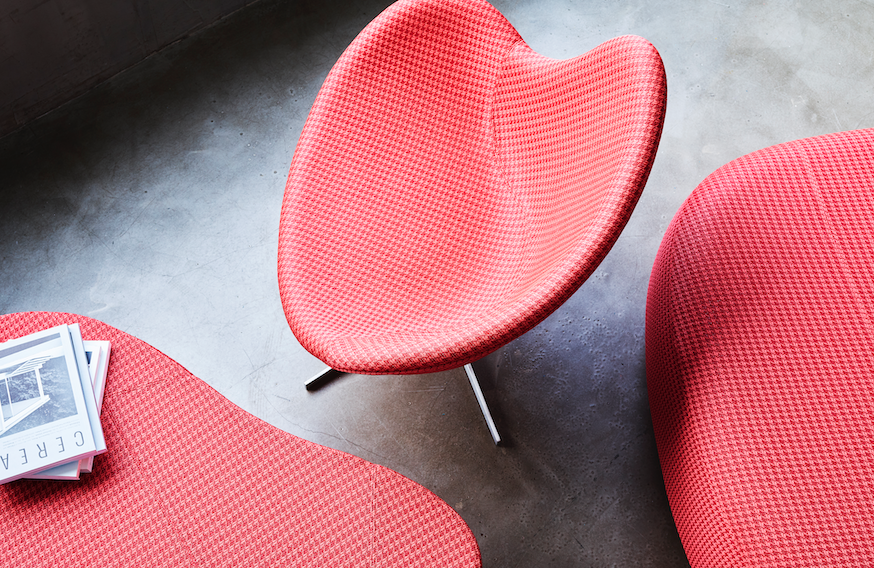 close-up view of three upholstered modern furniture pieces in red fabrics